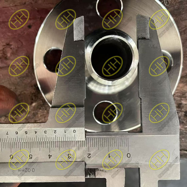Inspection of ASME B16.5 A182 UNS S31803 weld neck flange for surface finish and dimensional tolerances